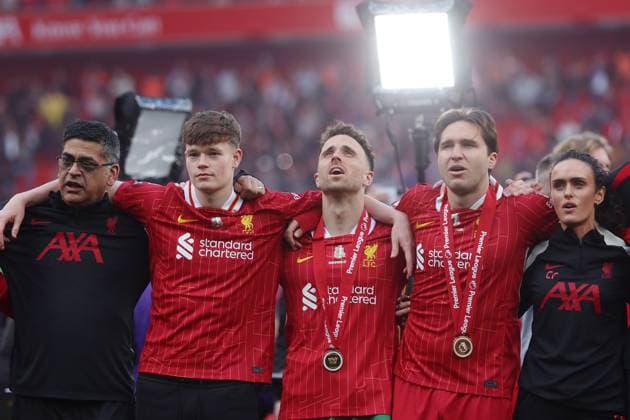 Federico Chiesa and Diogo Jota of Liverpool with staff and the trophy as they sing You ll Never Walk Alone as Liverpool are crowned champions for the 2024-2025 season Liverpool v Crystal Palace, Premier League, Football, Anfield, Liverpool, UK - 25 May 2025 EDITORIAL USE ONLY No use with unauthorised audio, video, data, fixture lists, club league logos or live services. Online in-match use limited to 120 images, no video emulation. No use in betting, games or single club league player publications. Copyright: xPaulxGreenwood Shutterstockx 15316427dm