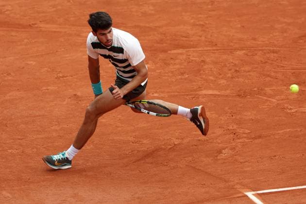 Carlos Alcaraz of Spain plays a tweener French Open Tennis, Day Two, Tennis, Roland Garros, Paris, France - 26 May 2025 EDITORIAL USE ONLY No use with unauthorised audio, video, data, fixture lists, club league logos or live services. Online in-match use limited to 120 images, no video emulation. No use in betting, games or single club league player publications. Copyright: xEllaxLing Shutterstockx 15318997a