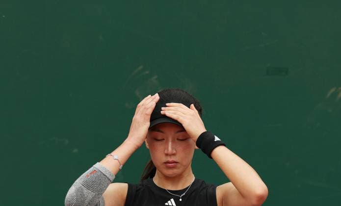 (250526) -- PARIS, May 26, 2025 -- Wang Xinyu reacts during the women s singles first round match between Wang Xinyu of China and Emma Raducanu of Britain at the French tennis tournament at Roland Garros in Paris, France, on May 26, 2025. ) (SP)FRANCE-PARIS-TENNIS-FRENCH OPEN-WOMEN S SINGLES GaoxJing 