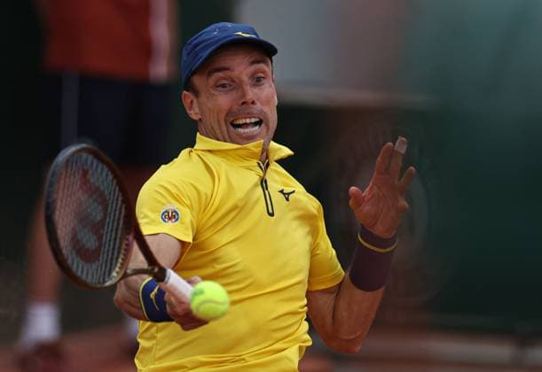 (250527) -- PARIS, May 27, 2025 -- Roberto Bautista Agut returns a shot during the men s singles first round match between Roberto Bautista Agut of Spain and Holger Rune of Denmark at the French Open tennis tournament at Roland Garros, Paris, France, May 26, 2025. ) (SP)FRANCE-PARIS-TENNIS-FRENCH OPEN-MEN S SINGLES LixJing 