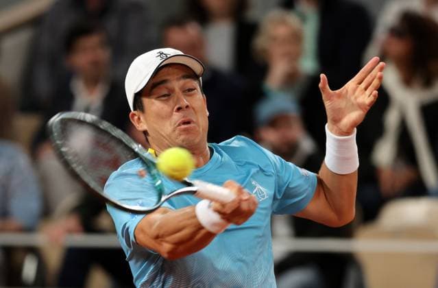 Mackenzie McDonald plays against Novak Djokovic of Serbia of the US during their first-round match at the French Tennis Open in Roland Garros in Paris, France, on Tuesday, May 27, 2025. Djokovic won 6-3, 6-3, 6-3.  PAR20250527308 MAYAxVIDON-WHITE