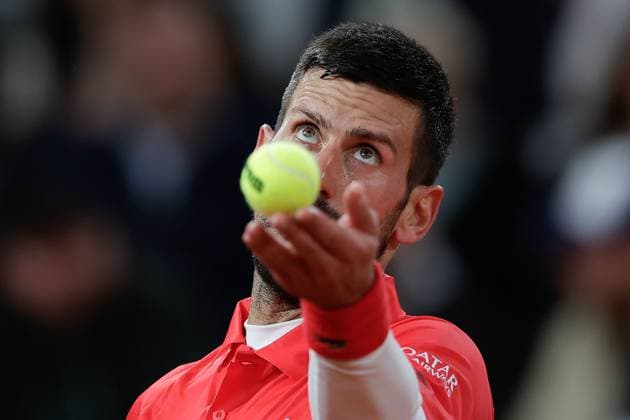 Paris 27 05 2025 xABx Tennis French Open 2025 Roland Garros, Mackenzie Mcdonald USA Novak Djokovic SER v l , Novak Djokovic SER makes a serve Copyright: HMBxMedia AntonioxBorga