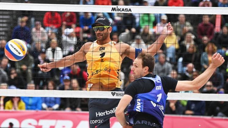 Marco Grimalt of Chile, left, and Ondrej Perusic of Czech Republic in action during the Groupe F men match Ondrej Perusic and David Schweiner of Czech Republic vs Marco Grimalt and Esteban Grimalt of Chile at the Pro Tour Elite Beach volleyball, Beachvolleyball tournament in Ostrava, Czech Republic, May 29, 2025. (CTKxPhoto JaroslavxOzana) CTKPhotoP2025052904085  CTKPhotoP2025052904085