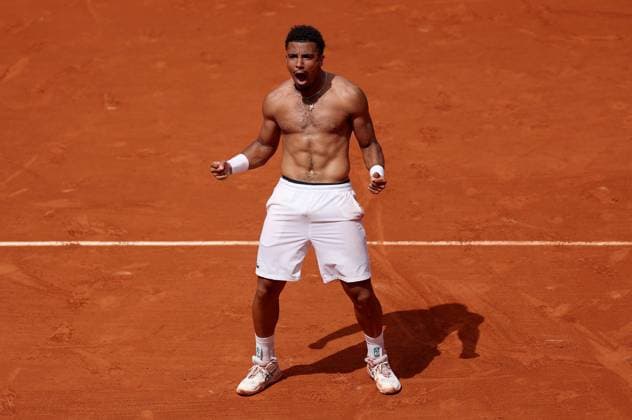 Arthur Fils of France celebrates ripping off his shirt following his win French Open Tennis, Day Five, Tennis, Roland Garros, Paris, France - 29 May 2025 EDITORIAL USE ONLY No use with unauthorised audio, video, data, fixture lists, club league logos or live services. Online in-match use limited to 120 images, no video emulation. No use in betting, games or single club league player publications.  Copyright: xEllaxLing Shutterstockx 15328391al