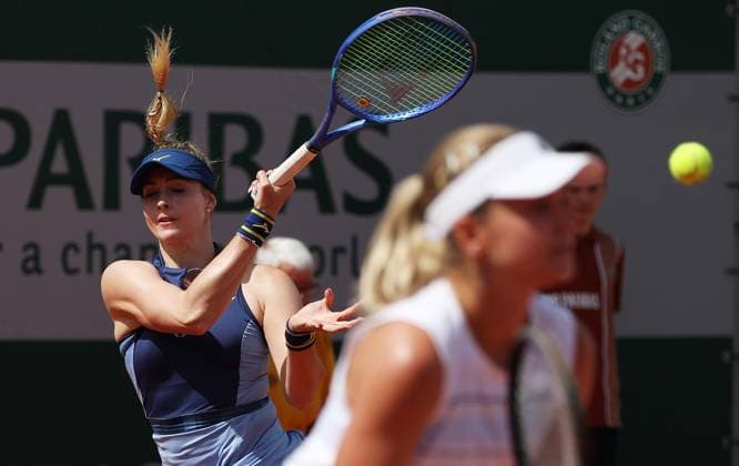 (250529) -- PARIS, May 29, 2025 -- Irina Khromacheva Fanny Stollar (L) compete during the women s doubles 1st round match between Wang Xinyu Zheng Saisai of China and Irina Khromacheva (Russia) Fanny Stollar (Hungary) at the French Open tennis tournament at Roland Garros, Paris, France, May 29, 2025. ) (SP)FRANCE-PARIS-TENNIS-FRENCH OPEN-WOMEN S DOUBLES GaoxJing 