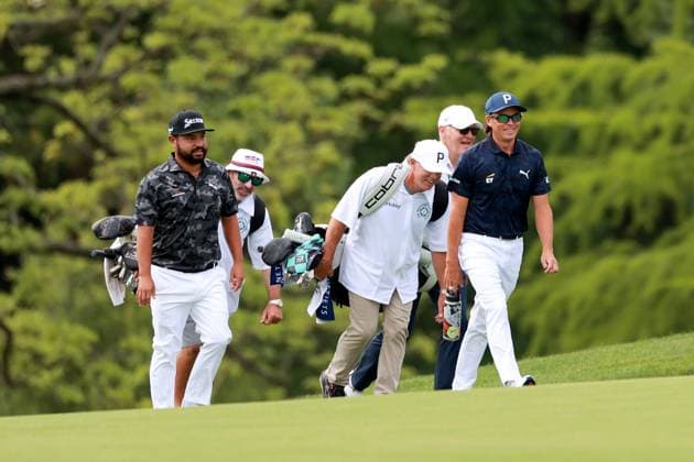 Memorial Tournament presented by Workday J.J. Spaun of the United States (L) and Rickie Fowler of the United States (R) walk with their caddies on the 10th fairway during the first round of the Memorial Tournament presented by Workday at Muirfield Village Golf Club on May 29, 2025 in Dublin, Ohio. Dublin Ohio United States  Copyright: xAmyxLemusx originalFilename:lemus-memorial250529_np61a.jpg