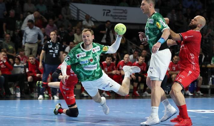 Mathias Gidsel scores a goal against goalkeeper Adam Morawski duel Game scene Action Sport Handball HBL Bundesliga Men 31 Matchday Season 2024 2026 29 05 2025 Füchse Berlin vs MT Melsungen