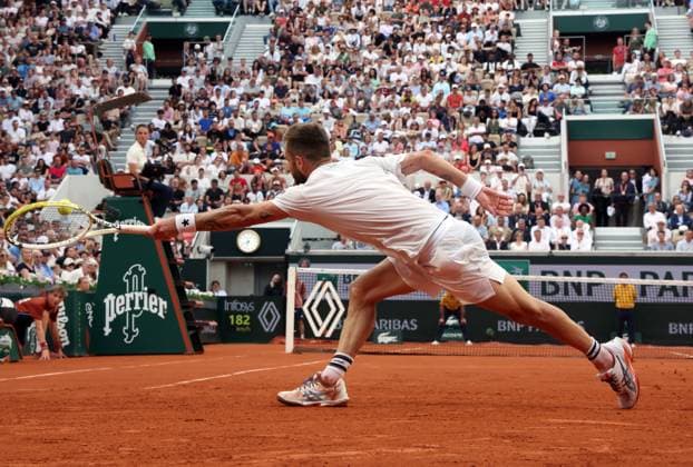 French Corentin Moutet plays against Czech Novak Djokovic during their second round match of the French Tennis Open at Roland Garros in Paris, France, on Thursday, May 29, 2025. Djokovic won 6-3, 6-2, 7-6.  PAR20250529305 MAYAxVIDON-WHITE