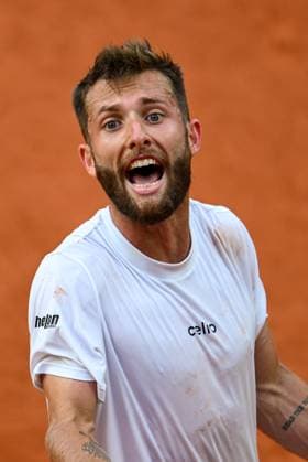 Sport Bilder des Tages Roland Garros 2025: Corentin Moutet (FRA) during the Men s Singles tennis match against Novak Djokovic on Suzanne Lenglen Court during the Grand Slam tennis tournament on May 29, 2025 at Roland Garros Stadium in Paris, France., France. - 29 05 2025 - France Ile-de-France (region) Paris -  JulienxMattiax xLexPictorium LePictorium_0309288
