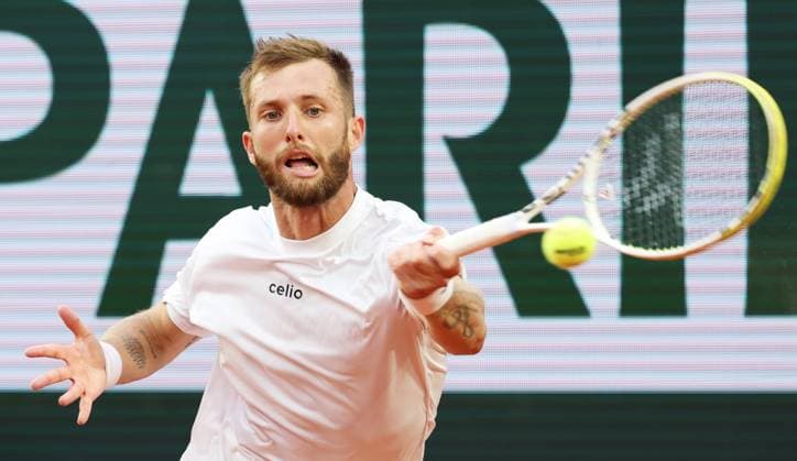 (250530) -- PARIS, May 30, 2025 -- Corentin Moutet of France hits a return during the men s singles second round match against Novak Djokovic of Serbia at French Open tennis tournament 2025 in Paris, France, May 29, 2025. ) (SP)FRANCE-PARIS-TENNIS-FRENCH OPEN-MEN S SINGLES GaoxJing 