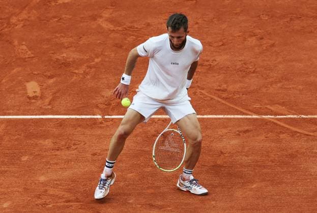 (250530) -- PARIS, May 30, 2025 -- Corentin Moutet of France hits a tweener during the men s singles second round match against Novak Djokovic of Serbia at French Open tennis tournament 2025 in Paris, France, May 29, 2025. ) (SP)FRANCE-PARIS-TENNIS-FRENCH OPEN-MEN S SINGLES GaoxJing 