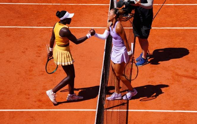 Qinwen Zheng shakes hands with Victoria Mboko her third round win French Open Tennis, Day Six, Tennis, Roland Garros, Paris, France - 30 May 2025 EDITORIAL USE ONLY No use with unauthorised audio, video, data, fixture lists, club league logos or live services. Online in-match use limited to 120 images, no video emulation. No use in betting, games or single club league player publications. Copyright: xJavierxGarcia Shutterstockx 15330911ah