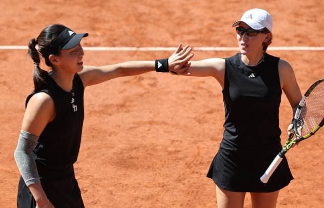 (250530) -- PARIS, May 30, 2025 -- Wang Xinyu Zheng Saisai (R) celebrate during the women s doubles 2nd round match between Wang Xinyu Zheng Saisai of China and Ulrikke Eikeri (Norway) Hozumi Eri (Japan) at the French Open tennis tournament at Roland Garros, Paris, France, May 30, 2025. ) (SP)FRANCE-PARIS-TENNIS-FRENCH OPEN-WOMEN S DOUBLES LixJing 