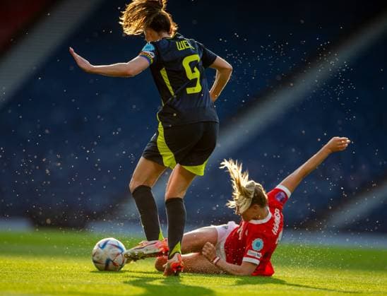 30th May 2025; Hampden Park, Glasgow, Scotland; Womens Nations League, Group 1 International Football, Scotland versus Austria; Marie Hobinger of Austria slide tackles Caroline Weir of Scotland  ActionPlus12795989 VagelisxGeorgariou