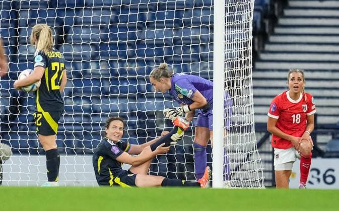 Rachel Corsie of Scotland Women gets a leg stretch from Scotland Women goalkeeper Lee Gibson. Scotland Women v Austria Women, UEFA Women s Nations League - League A - Group 1, Football, Hampden Park, Glasgow, Scotland, UK - 30 May 2025 EDITORIAL USE ONLY No use with unauthorised audio, video, data, fixture lists, club league logos or live services. Online in-match use limited to 120 images, no video emulation. No use in betting, games or single club league player publications. Copyright: xStuartxWallace Shutterstockx 15330905br