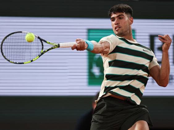 (250531) -- PARIS, May 31, 2025 -- Carlos Alcaraz of Spain returns a shot during the men s singles third round match against Damir Dzumhur of Bosnia and Herzegovina at the French Open tennis tournament at Roland Garros, Paris, France, May 30, 2025. ) (SP)FRANCE-PARIS-TENNIS-FRENCH OPEN-MEN S SINGLES LixJing 