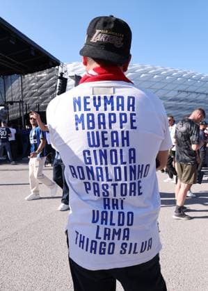 Munich, Germany, 31st May 2025. A fan with a t-shirt listing the great of football before the Paris Saint Germain vs Internazionale UEFA Champions League Final match at Munich Football Arena, Munich. Picture credit should read: David Klein Sportimage EDITORIAL USE ONLY. No use with unauthorised audio, video, data, fixture lists, club league logos or live services. Online in-match use limited to 120 images, no video emulation. No use in betting, games or single club league player publications. SPI_017_DK_UCL_Final SPI-3964-0018