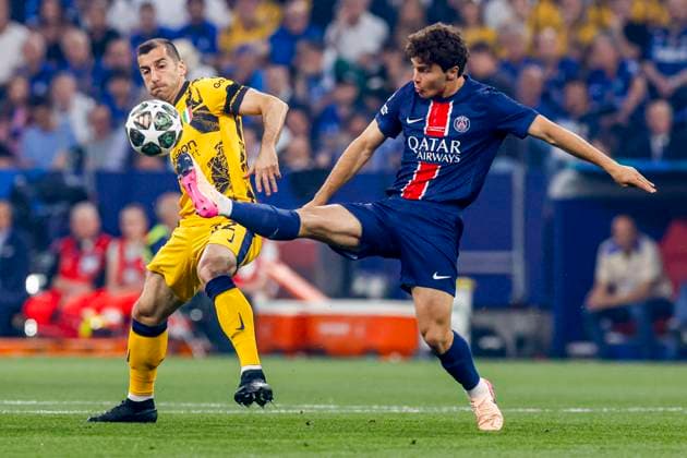 Joao Neves of Paris Saint-Germain passes the ball under pressure from Henrikh Mkhitaryan of FC Internazionale Paris Saint-Germain v FC Internazionale Milano, UEFA Champions League Final 2025, Paris Saint-Germain and FC Internazionale Milano, Munich Football Arena, May 31, 2025, Munich, Germany.