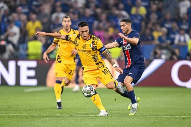 Lautaro Martinez FC Internazionale Milano and Achraf Hakimi Paris Saint Germain battle for the ball during the UEFA Champions League Final 2025 between Paris Saint Germain and FC Internazionale Milano at Munich Football Arena on May 31, 2025 in Munich, Germany Photo by Harry Langer DeFodi Images