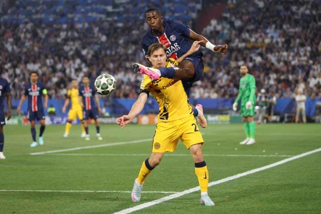 Nicolò Barella Inter Milan and Willian Pacho Paris Saint Germain battle for the ball during the UEFA Champions League Final 2025 between Paris Saint Germain and FC Internazionale Milano at Munich Football Arena on May 31, 2025 in Munich, Germany Photo by Oliver Kaelke DeFodi Images