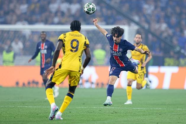 Vitinha of PSG heads past Marcus Thuram of Inter Milan Paris Saint-Germain v Inter Milan, UEFA Champions League Final, Football, Allianz Arena, Munich, Germany - 31 May 2025 EDITORIAL USE ONLY No use with unauthorised audio, video, data, fixture lists, club league logos or live services. Online in-match use limited to 120 images, no video emulation. No use in betting, games or single club league player publications. Copyright: xMichaelxZemanek Shutterstockx 15330931bi