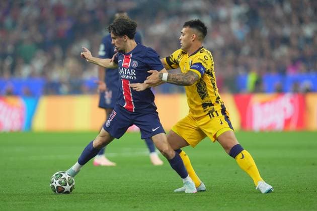 Inter MilanÕs Lautaro Martinez fights for the ball with PSG s Vitinha during the Uefa Champions League Final soccer match between Paris Saint Germain and FC Inter at Allianz Arena in Munich , Germany - Saturday May 31, 2025 . - Soccer  Copyright: xSpada LaPressex