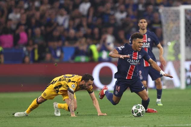 Munich, Germany, 31st May 2025. Desire Doue of Paris St Germain brought down by Hakan Calhanoglu of Inter Milan during the Paris Saint Germain vs Internazionale UEFA Champions League Final match at Munich Football Arena, Munich. Picture credit should read: David Klein Sportimage EDITORIAL USE ONLY. No use with unauthorised audio, video, data, fixture lists, club league logos or live services. Online in-match use limited to 120 images, no video emulation. No use in betting, games or single club league player publications. SPI_073_DK_UCL_Final SPI-3964-0073