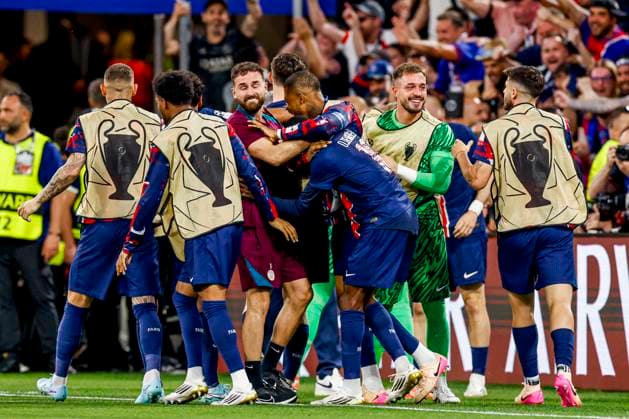 Khvicha Kvaratskhelia of Paris Saint-Germain celebrates with teammates after scoring his teams fourth goal Paris Saint-Germain v FC Internazionale Milano, UEFA Champions League Final 2025, Paris Saint-Germain and FC Internazionale Milano, Munich Football Arena, May 31, 2025, Munich, Germany.