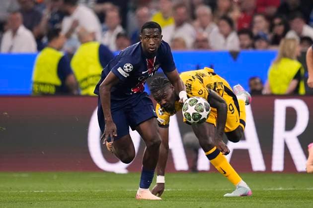 Paris Saint-Germain v FC Internazionale Milano - UEFA Champions League Final 2025 MUNICH, GERMANY - MAY 31: Willian Pacho centre-back of PSG and Ecuador competes for the ball with Marcus Thuram centre-forward of Internazionale and France during the UEFA Champions League Final 2025 between Paris Saint-Germain and FC Internazionale Milano at Allianz Arena on May 31, 2025 in Munich, Germany. Munich Germany  Copyright: xJosexBretonx originalFilename:bretonhernandez-parissai250531_npyD1.jpg