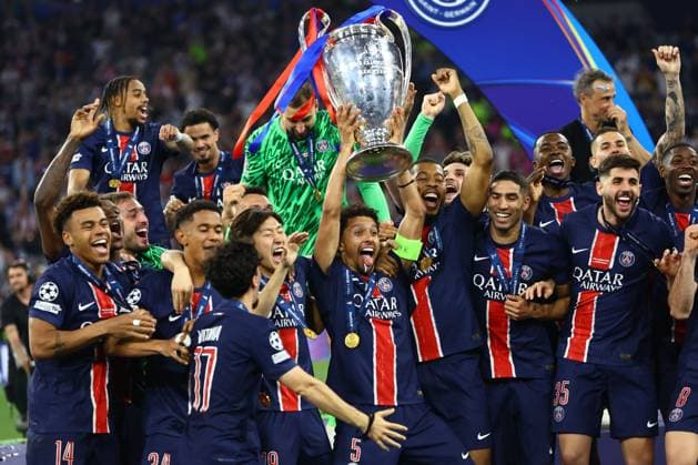 Marquinhos of PSG lifts the Champions League trophy Paris Saint-Germain v Inter Milan, UEFA Champions League Final, Football, Allianz Arena, Munich, Germany - 31 May 2025 EDITORIAL USE ONLY No use with unauthorised audio, video, data, fixture lists, club league logos or live services. Online in-match use limited to 120 images, no video emulation. No use in betting, games or single club league player publications. Copyright: xMichaelxZemanek Shutterstockx 15330931eb