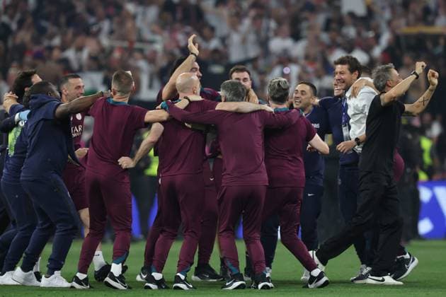 Luis Enrique (right), head coach of Paris Saint-Germain celebrates with his technical staff members and players after his team had beaten Internazionale Milano 5-0 in the UEFA Champions League Final between Paris Saint-Germain and FC Internazionale Milano at the Munich Football Arena on May 31, 2025 in Munich, Germany. UEFA Champions League Final 2025 - Paris Saint-Germain v FC Internazionale Milano