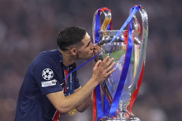 Munich, Germany, 31st May 2025. Achraf Hakimi of Paris St Germain kisses the trophy in celebration during the Paris Saint Germain vs Internazionale UEFA Champions League Final match at Munich Football Arena, Munich. Picture credit should read: David Klein Sportimage EDITORIAL USE ONLY. No use with unauthorised audio, video, data, fixture lists, club league logos or live services. Online in-match use limited to 120 images, no video emulation. No use in betting, games or single club league player publications. SPI_129_DK_UCL_Final SPI-3964-0131