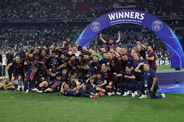 Paris Saint-Germain players and technical staff celebrate after the UEFA Champions League Final between Paris Saint-Germain and FC Internazionale Milano at the Munich Football Arena on May 31, 2025 in Munich, Germany. UEFA Champions League Final 2025 - Paris Saint-Germain v FC Internazionale Milano