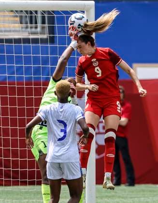 May 31, 2025, Winnipeg, Mb, CANADA: Haiti s goalkeeper Kavona Cesar Pietrus (1) saves the header from Canada s Jordyn Huitema (9) during first half soccer action in Winnipeg, Saturday, May 31, 2025. Haiti Canada Womens Soccer  - ZUMAc35_ 20250531_zaf_c35_089 Copyright: xJohnxWoodsx