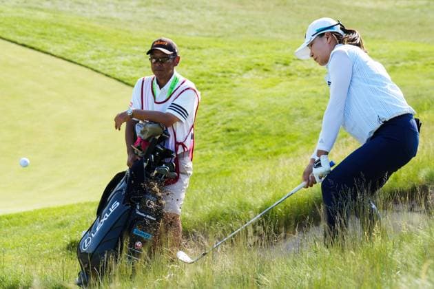 May 31, 2025, Madison, Wisconsin, USA: HINAKO SHIBUNO of Japan (right) hits an iron out of the rough on the 16h hole while her caddie HIROSHI SASAKI (left) looks during the third round of the 2025 LPGA, Golf Damen U.S. Womens Open at Erin Hills Golf Course in Erin, Wis. Madison USA - ZUMAb262 20250531_znp_b262_036 Copyright: xJeffxM.xBrownx