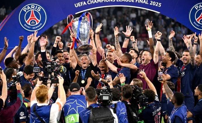 MUNICH, GERMANY - MAY 31: Luis Enrique head coach of Paris Saint-Germain lifts the UEFA Champions League trophy after his team s victory, to secure Paris Saint-Germain s first ever UEFA Champions League title in the club s history and a record UEFA Champions League Final winning scoreline of 5-0, after the UEFA Champions League Final 2025 between Paris Saint-Germain and FC Internazionale Milano at Munich Football Arena on May 31, 2025 in Munich, Germany. SPO 