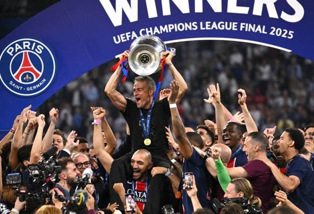 MUNICH, GERMANY - MAY 31: Luis Enrique head coach of Paris Saint-Germain lifts the UEFA Champions League trophy after his team s victory, to secure Paris Saint-Germain s first ever UEFA Champions League title in the club s history and a record UEFA Champions League Final winning scoreline of 5-0, after the UEFA Champions League Final 2025 between Paris Saint-Germain and FC Internazionale Milano at Munich Football Arena on May 31, 2025 in Munich, Germany. SPO 