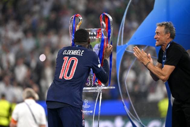 MUNICH, GERMANY - MAY 31: Ousmane Dembele of PSG kiss the Uefa CHL Trophy with Luis Enrique head coach of Paris Saint-Germain after the victory of the UEFA Champions League Final 2025 between Paris Saint-Germain and FC Internazionale Milano at Allianz Arena on May 31, 2025 in Munich, Germany. SPO 