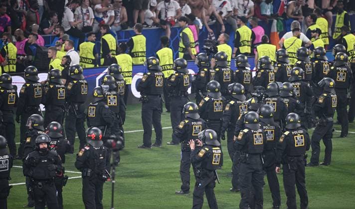 Football CHL FINAL 2024 2025 Final in Munich 31 05 2025 Paris Saint Germain Inter Milan A hundred police officers stand on the pitch of the arena in Munich after the match Paris Saint Germain fans celebrate winning the Champions League