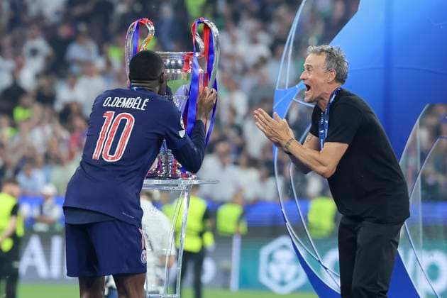 Ousmane Dembele Paris Saint Germain kisses the trophy for winning the UEFA Champions League and coach Luis Enrique Paris Saint Germain claps his hands in jubilation, UEFA Champions League Final 2025, Paris Saint Germain and FC Internazionale Milano, Allianz Arena on May 31, 2025 in Munich, Germany Photo by Marco Steinbrenner DeFodi Images Ousmane Dembele Paris Saint Germain kisses the trophy for winning the UEFA Champions League and coach Luis Enrique Paris Saint Germain claps his hands in jubilation, UEFA Champions League Final 2025, Paris Saint Germain and FC Internazionale Milano, Munich Football Arena, May 31, 2025 in Munich, Germany Photo by Marco Steinbrenner DeFodi Images