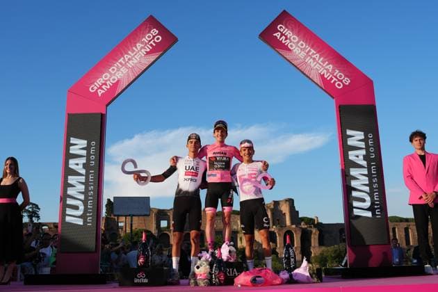 Britain s Simon Philip Yates of Team Visma Lease A Bike pink jersey on the podium (center), Isaac Romero Del Toro of Uae Team Emirates Xrg white jersey on the podium (left), Richard Carapaz of Ef Education - Easypost (right) after the stage 21 of the Giro d™Italia from Roma to Roma, Italy - Sunday, June 01, 2025. - cycling.  Copyright: xGianxMattiaxD Alberto LaPressex