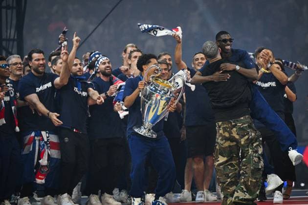 PSG celebrates Champions League trophy at Parc des Princes - FA DJ Snake hugs Paris Saint-Germain’s forward Ousmane Dembele as Paris Saint-Germain’s players celebrate the UEFA Champions League trophy at the Parc des Princes Stadium in Paris on June 1, 2025, the day after PSG won the UEFA Champions League final football match over Inter Milan in Munich, on May 31, 2025. Photo by Firas Abdullah ABACAPRESS.COM Paris Ile-de-France France  Copyright: xAbdullahxFiras ABACAx