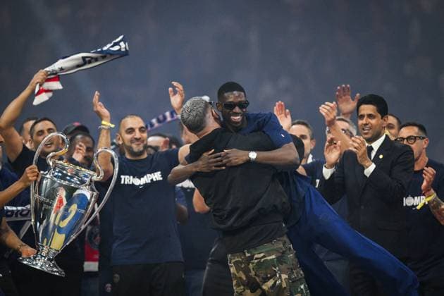 PSG celebrates Champions League trophy at Parc des Princes - FA DJ Snake hugs Paris Saint-Germain’s forward Ousmane Dembele as Paris Saint-Germain’s players celebrate the UEFA Champions League trophy at the Parc des Princes Stadium in Paris on June 1, 2025, the day after PSG won the UEFA Champions League final football match over Inter Milan in Munich, on May 31, 2025. Photo by Firas Abdullah ABACAPRESS.COM Paris Ile-de-France France  Copyright: xAbdullahxFiras ABACAx