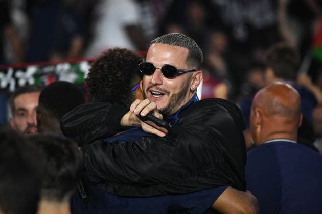 PSG celebrates Champions League trophy at Parc des Princes - FA DJ Snake hugs Paris Saint-Germain’s forward Desire Doue as Paris Saint-Germain’s players celebrate the UEFA Champions League trophy at the Parc des Princes Stadium in Paris on June 1, 2025, the day after PSG won the UEFA Champions League final football match over Inter Milan in Munich, on May 31, 2025. Photo by Firas Abdullah ABACAPRESS.COM Paris Ile-de-France France  Copyright: xAbdullahxFiras ABACAx