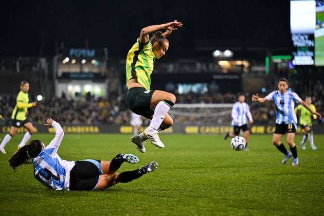SOCCER AUSTRALIA ARGENTINA, Caitlin Foord of Australia is tackled by Catalina Roggerone of Argentina during the Women s friendly international soccer match between Australia and Argentina at GIO Stadium in Canberra, Monday, June 2, 2025. ( NO ARCHIVING, EDITORIAL USE ONLY CANBERRA AUSTRALIAN CAPITAL TERRITORY AUSTRALIA  Copyright: xLUKASxCOCHx 20250602145485236911