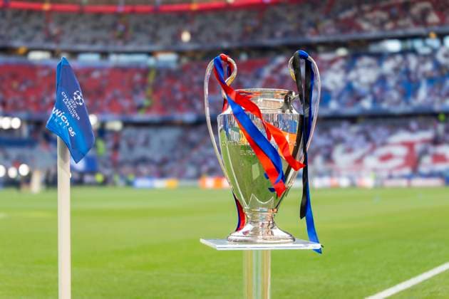 31 05 2025, Football UEFA Champions League Final 2025 Paris St Germain Inter Milan, in the Allianz Arena Munich The Champions League trophy stands ready on the stele Decorated with ribbons in the club colors of the two final teams