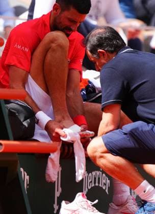 Novak Djokovic gets treatment on his foot French Open Tennis, Day Nine, Tennis, Roland Garros, Paris, France - 02 Jun 2025 EDITORIAL USE ONLY No use with unauthorised audio, video, data, fixture lists, club league logos or live services. Online in-match use limited to 120 images, no video emulation. No use in betting, games or single club league player publications. Copyright: xJavierxGarcia Shutterstockx 15335297bt