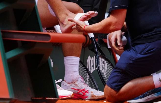 Novak Djokovic gets treatment on his foot French Open Tennis, Day Nine, Tennis, Roland Garros, Paris, France - 02 Jun 2025 EDITORIAL USE ONLY No use with unauthorised audio, video, data, fixture lists, club league logos or live services. Online in-match use limited to 120 images, no video emulation. No use in betting, games or single club league player publications. Copyright: xJavierxGarcia Shutterstockx 15335297bu
