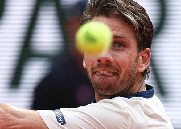(250603) -- PARIS, June 3, 2025 -- Cameron Norrie of Britain eyes the ball while competing against Novak Djokovic of Serbia during the men s singles 4th round match at the French Open tennis tournament at Roland Garros, Paris, France, June 2, 2025. ) (SP)FRANCE-PARIS-TENNIS-FRENCH OPEN-MEN S SINGLES LixJing 