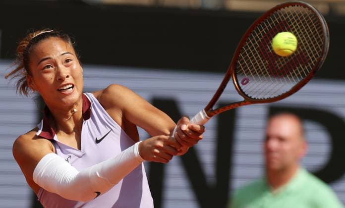 (250603) -- PARIS, June 3, 2025 -- Zheng Qinwen returns a shot during the women s singles quarterfinal between Zheng Qinwen of China and Aryna Sabalenka of Belarus at the French Open tennis tournament at Roland Garros, Paris, France, June 3, 2025. ) (SP)FRANCE-PARIS-TENNIS-FRENCH OPEN-WOMEN S SINGLES-QUARTERFINAL GaoxJing 